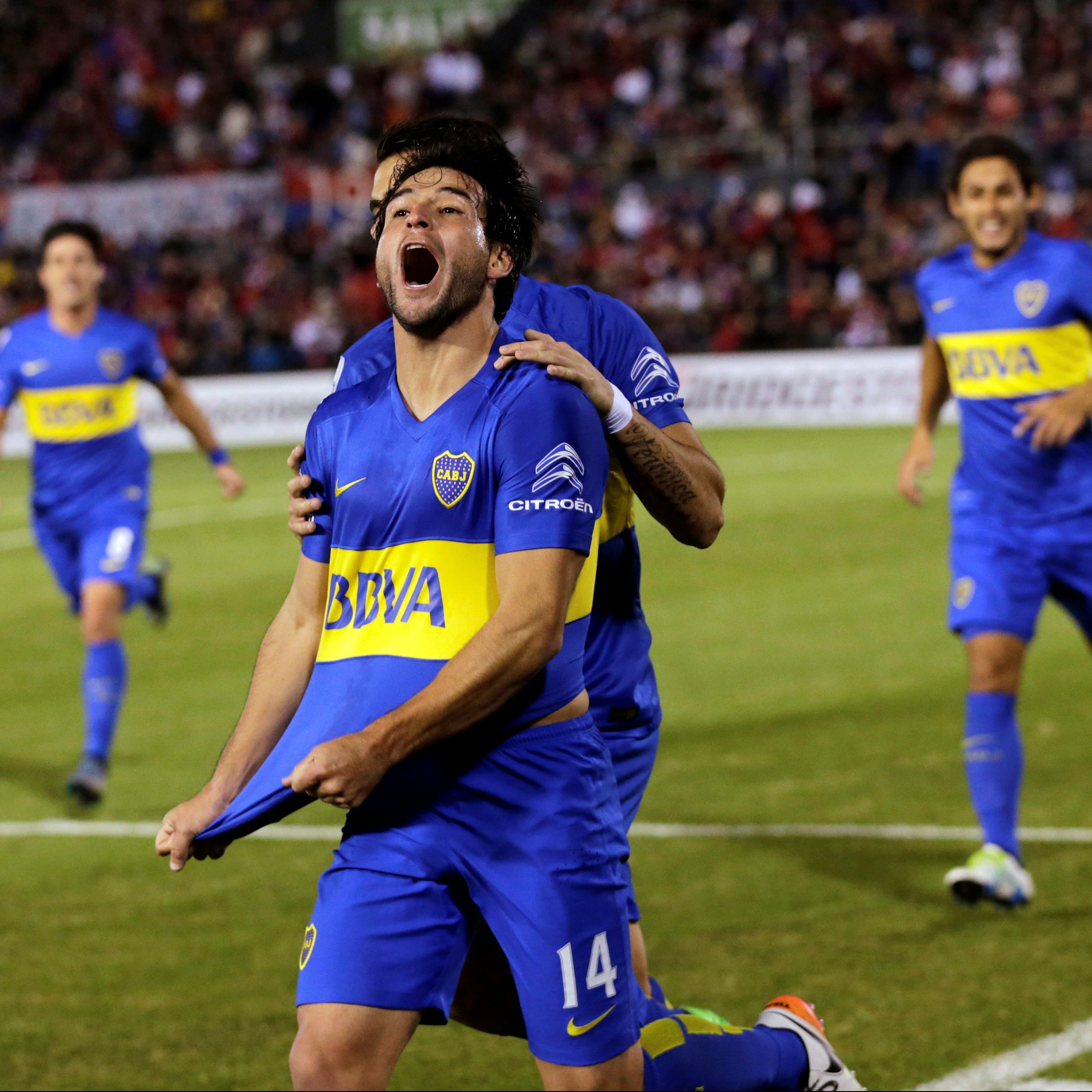 Football Soccer - Argentina Boca Juniors v Cerro Porteno - Copa Libertadores - Defensores del Chaco Stadium, Asuncion, Paraguay 28/04/2016. Boca Juniors' Nicolas Lodeiro (C) celebrates with his teammates after he scores a goal. REUTERS/Jorge Adorno